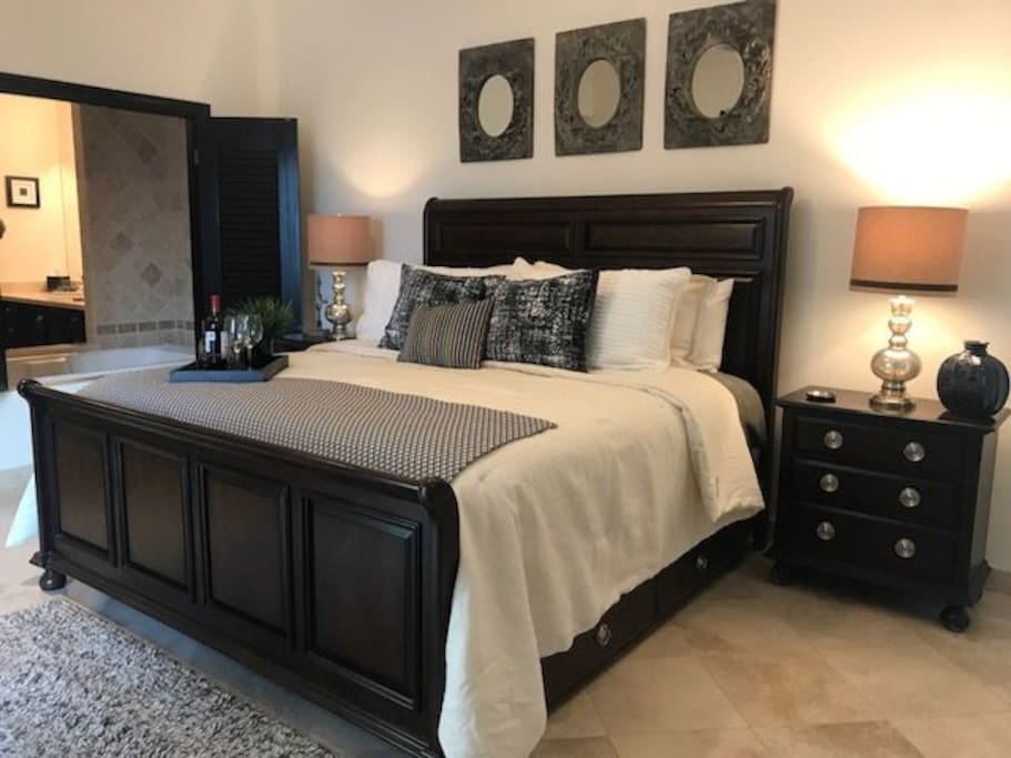 The master bedroom offers a jacuzzi tub that separates the bedroom from the bathroom. Need privacy? The shutters allow you the close off the bathroom.