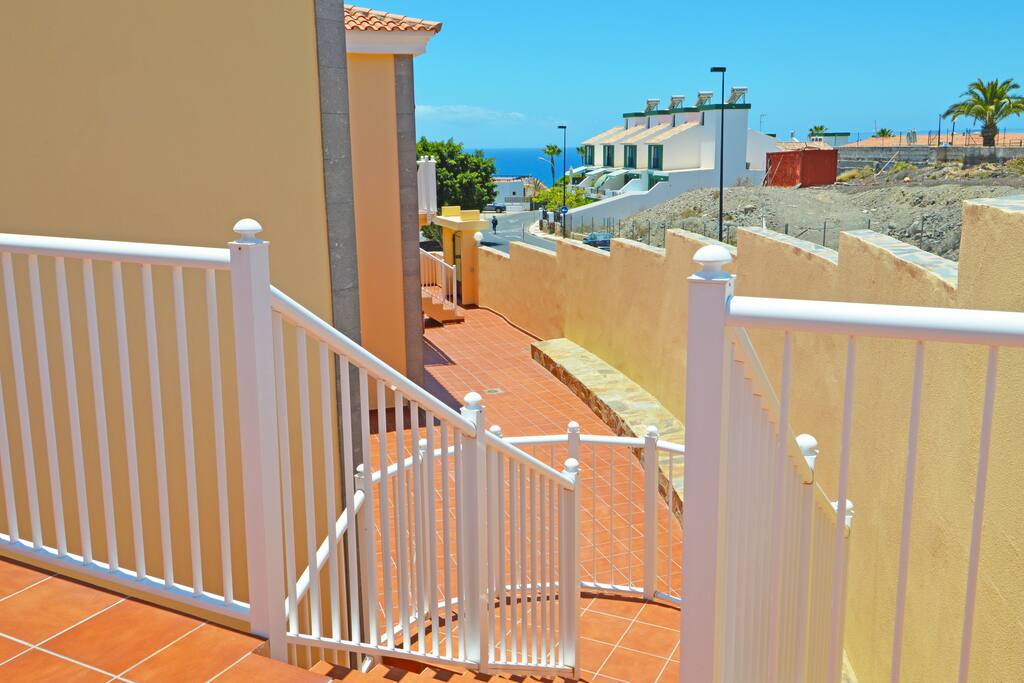 Stairs down to pool area and lower apartments