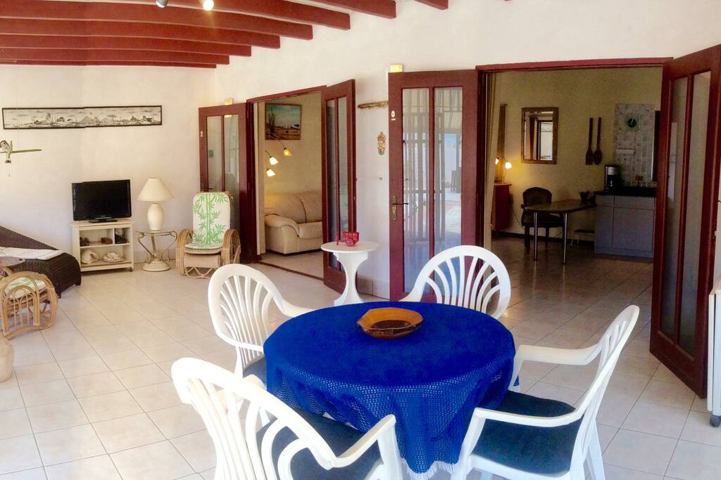 Porch with open doors to Living room/Kitchen
