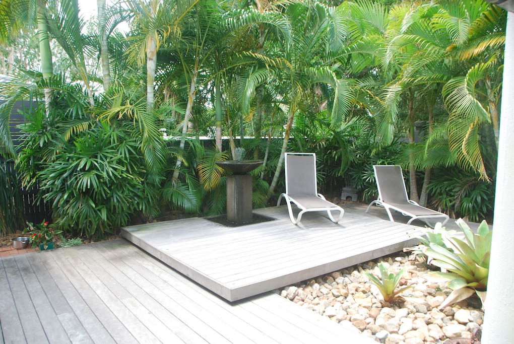 Soak up the sun on the deck chairs overlooking pool.