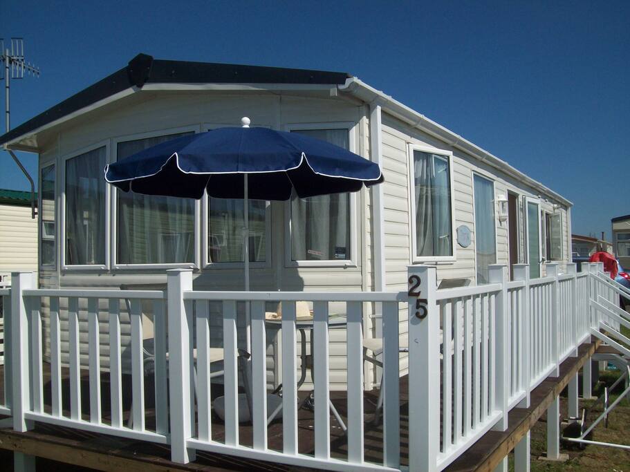 wrap around balcony with outdoor furniture for sunny days