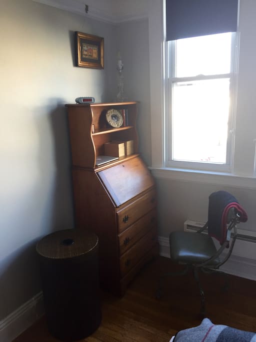 Secretary desk fold open for computer workspace.
