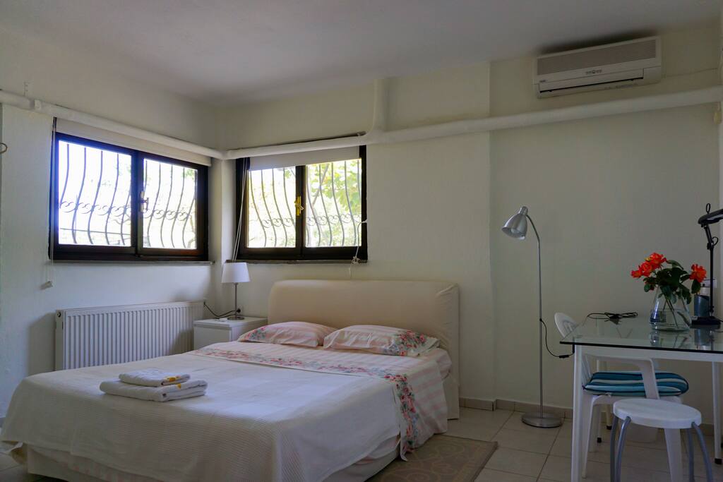 The double bed in bedroom #1