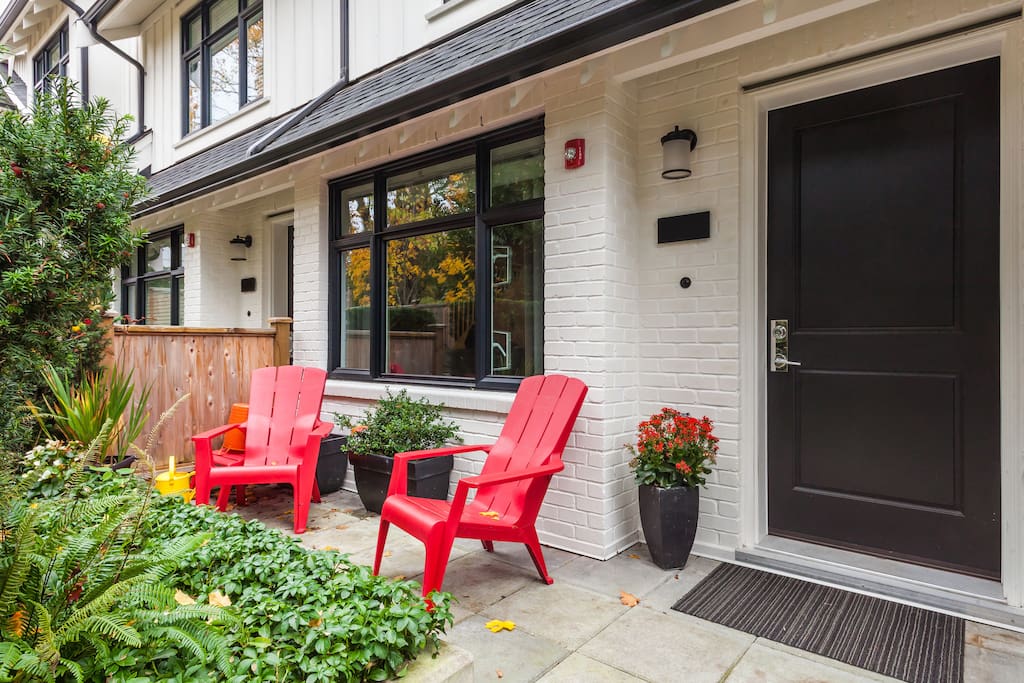 Front porch, you will recognize our house with the red chairs out front.