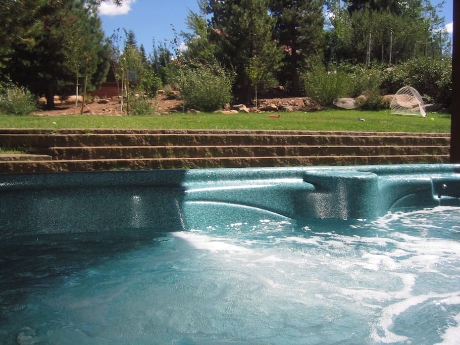 hot tub summer showing grass play area