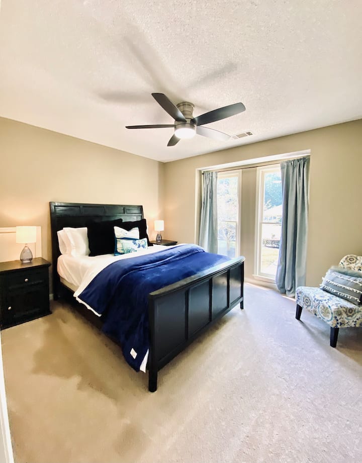 The secondary bedroom features a queen size bed, 2 nightstands with lamps, remote controlled fan light, full closet, plus seating.  