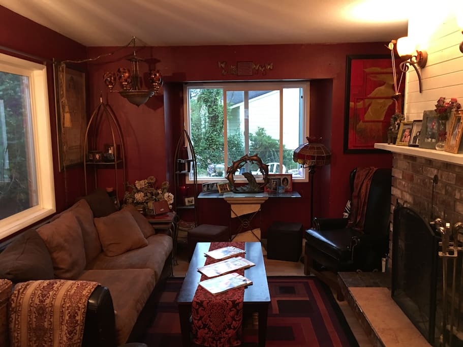 The living room. Quaint, with a fireplace.