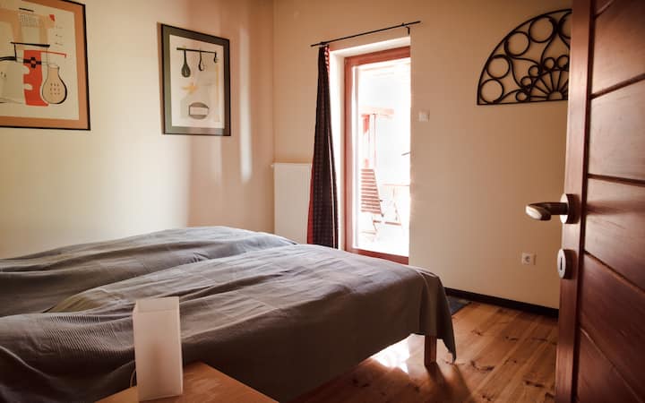 Another bedroom on the ground floor with a king size bed (and a patio door)