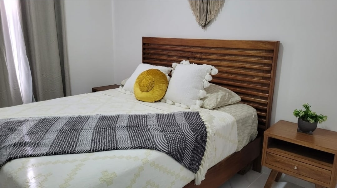 The master bedroom has a small area for working in a home office and an executive chair.