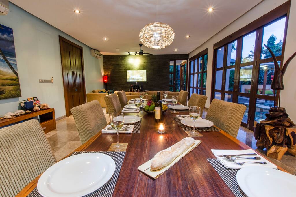 long dinning table next to your fully furnished American kitchen