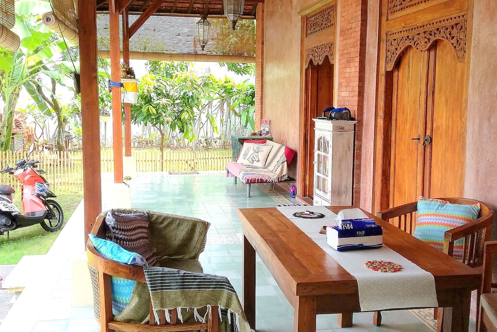 Open veranda comes with dining room and lazy sofa