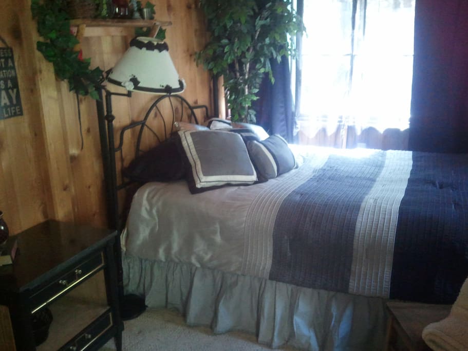 plenty of windows to watch it snow in this queen size bed