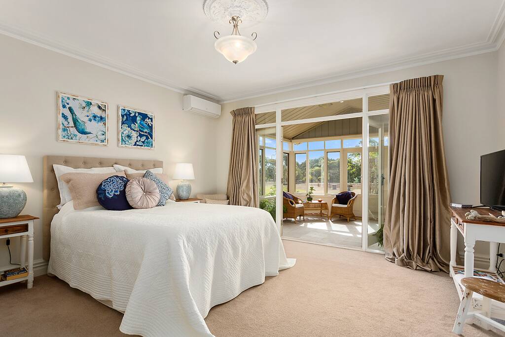 Your spacious bedroom opens into the Conservatory