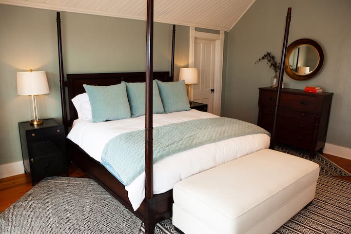 The master bedroom lures you in with a memory foam king sized bed, luxury linens, a 55" flat screen TV, room darkening shades, and a reading nook. The en-suite bathroom offers a whirlpool tub and shower, hairdryer, high end linens, and toiletries. 