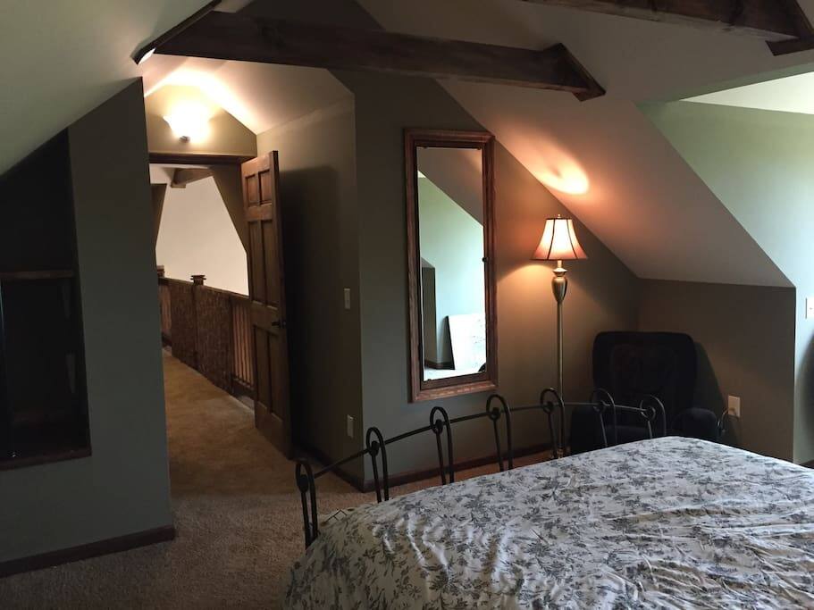 The door to the main common areas. The mirror opens to a small closet for hanging clothes.