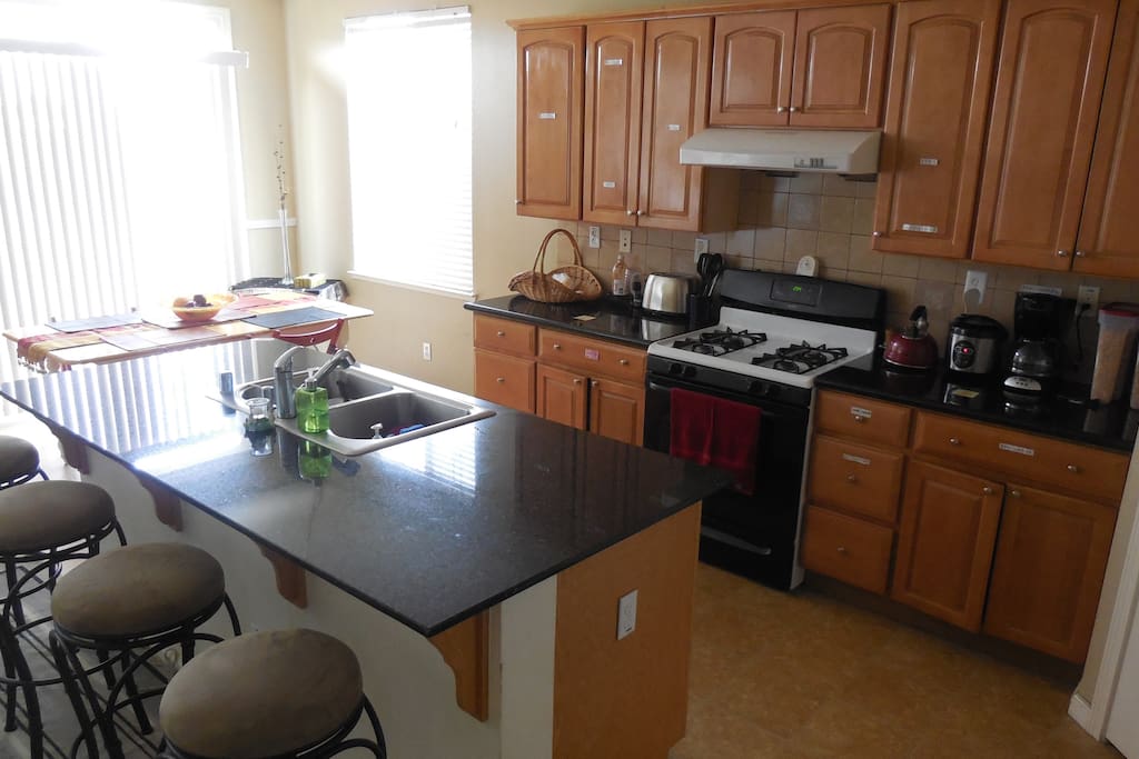 Dining, breakfast bar, and kitchen areas.