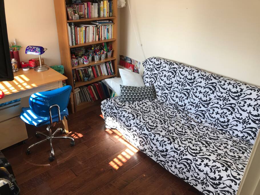 Futon bed makes into a double. It’s small for 2 people. Nice sunny room.