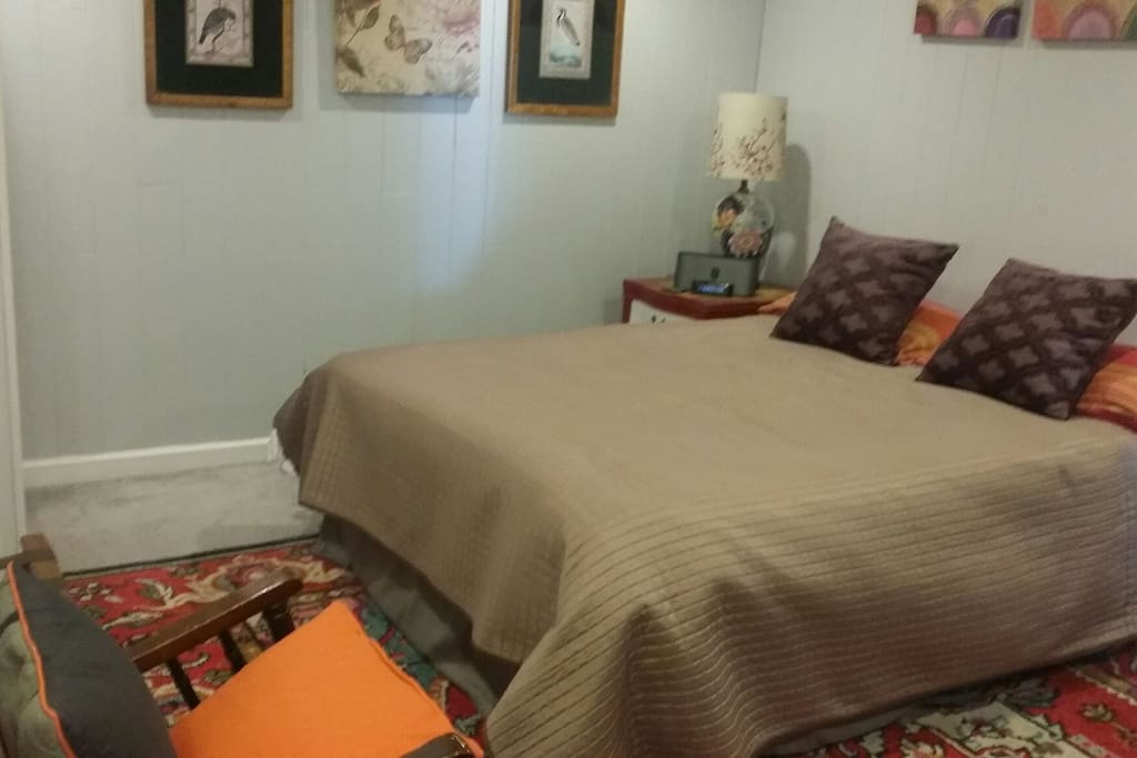 A large bedroom with a comfortable queen-size bed. Two wardrobe closets provide plenty of room for your belongings.
