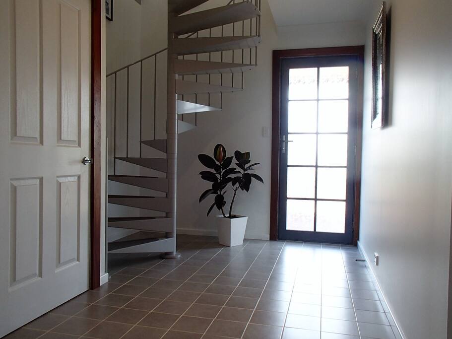 inside front entrance and access to upstairs living and kitchen