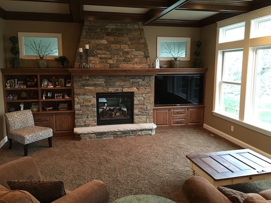 Open living room with double sided fireplace