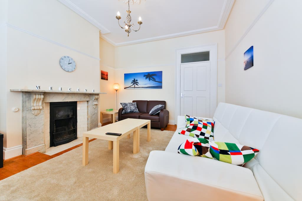 Homely living room with a sofa bed and dining area