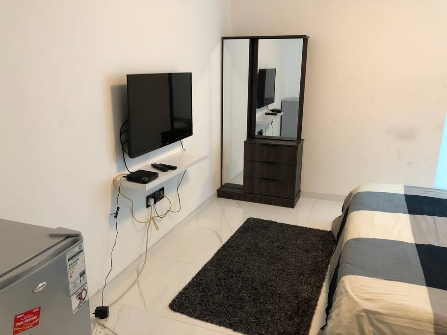 Tv with package + fridge