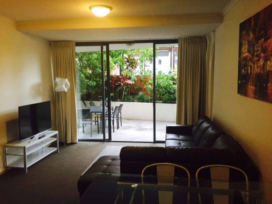 Lounge + dining area with smart tv