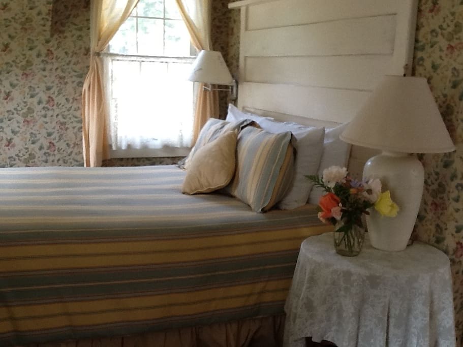 Jim's room upstairs in Farmhouse. Nice view of pond. Queen bed.