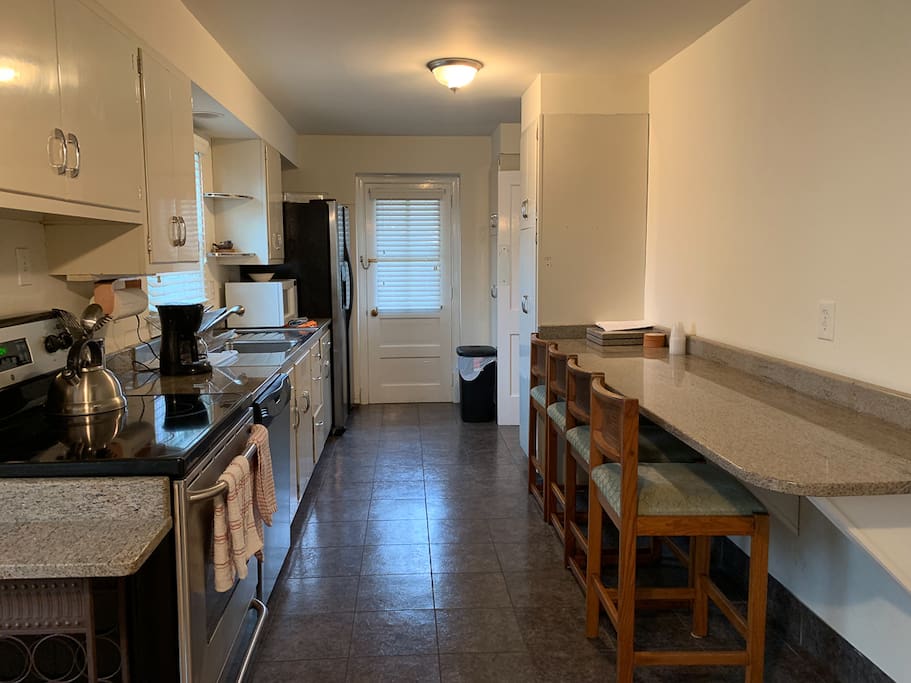 Full kitchen with stove, oven, dishwasher, toaster, microwave, and more.