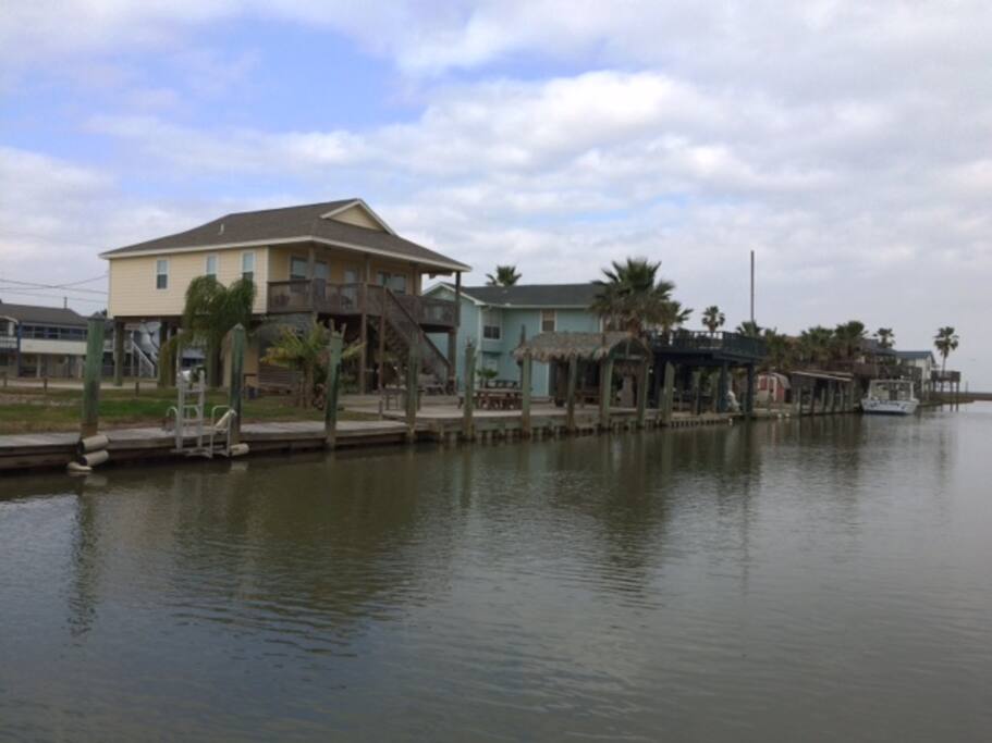 Yellow canal home, with access to bays and gulf.