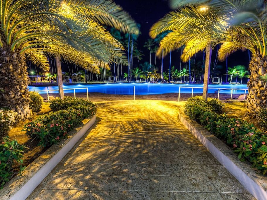 Night time view of 1 of 2 large pools