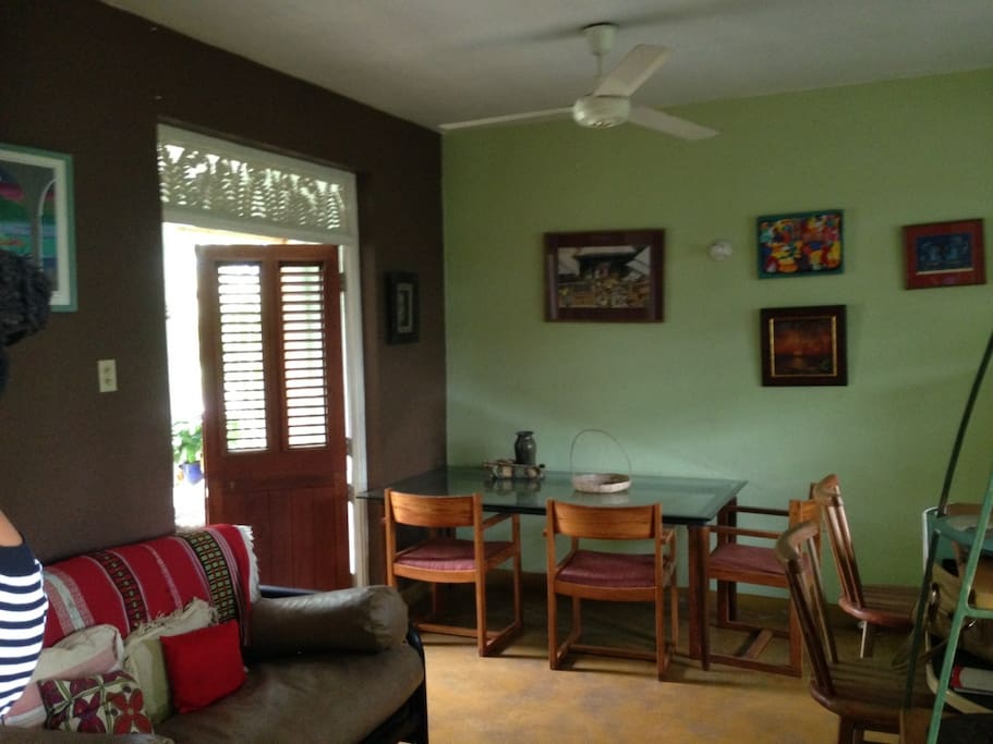 living and dining area open on to an enclosed patio