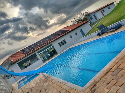Spacious farmhouse with pool and very green.