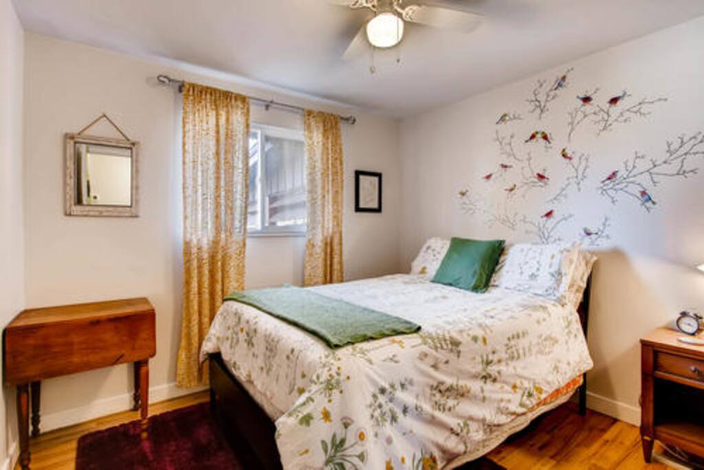 The room includes vintage furniture and peaceful decor.