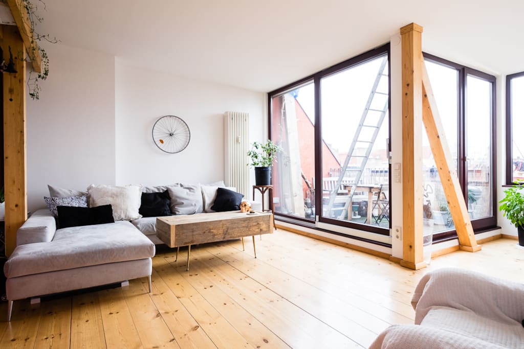 Main room, with huge floor-to-ceiling sliding windows ushering you into the rooftop patio. Electric blinds provide immediate privacy at the push of a button.