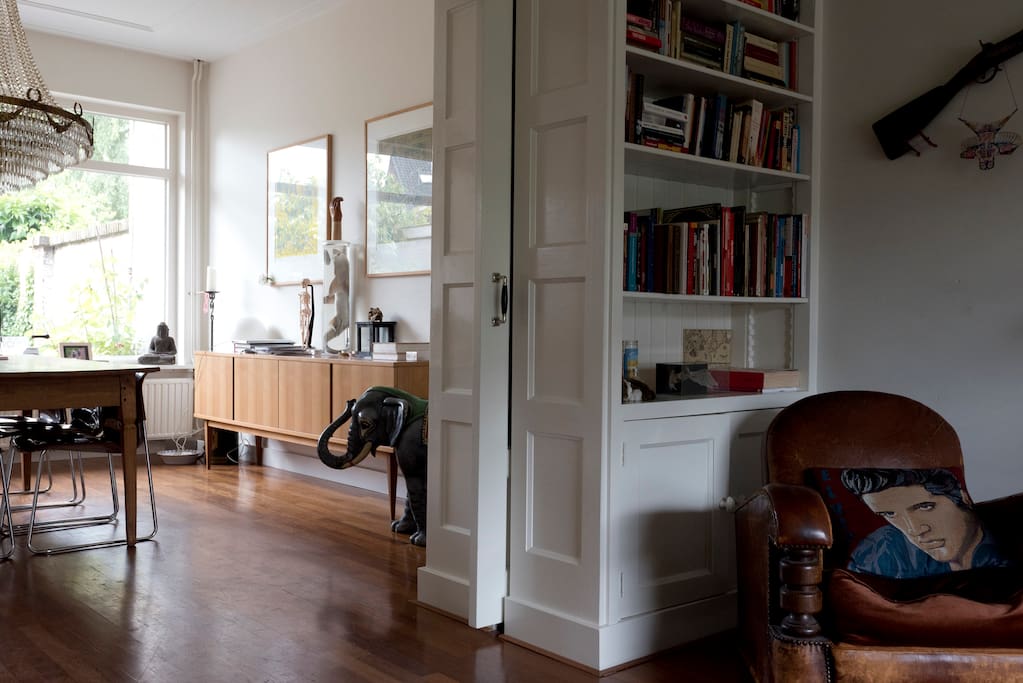 Spacious living room and dining room divided by en suite doors.