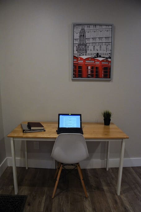Handmade birch desk and a comfy chair for any work you might bring with you.