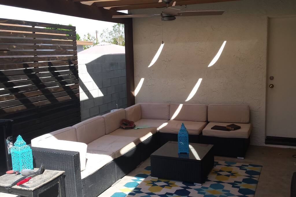 Large L-shaped couch outside near the pool. Perfect for lounging!