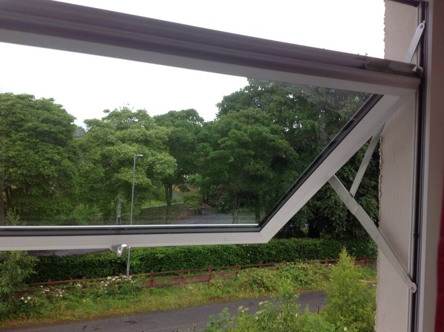 The large window opens fully to allow the view of the walkway.
