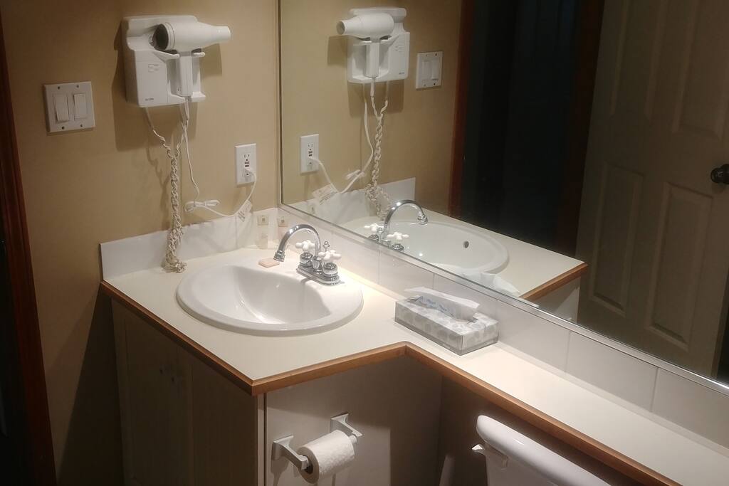 vanity, shower and bath tub