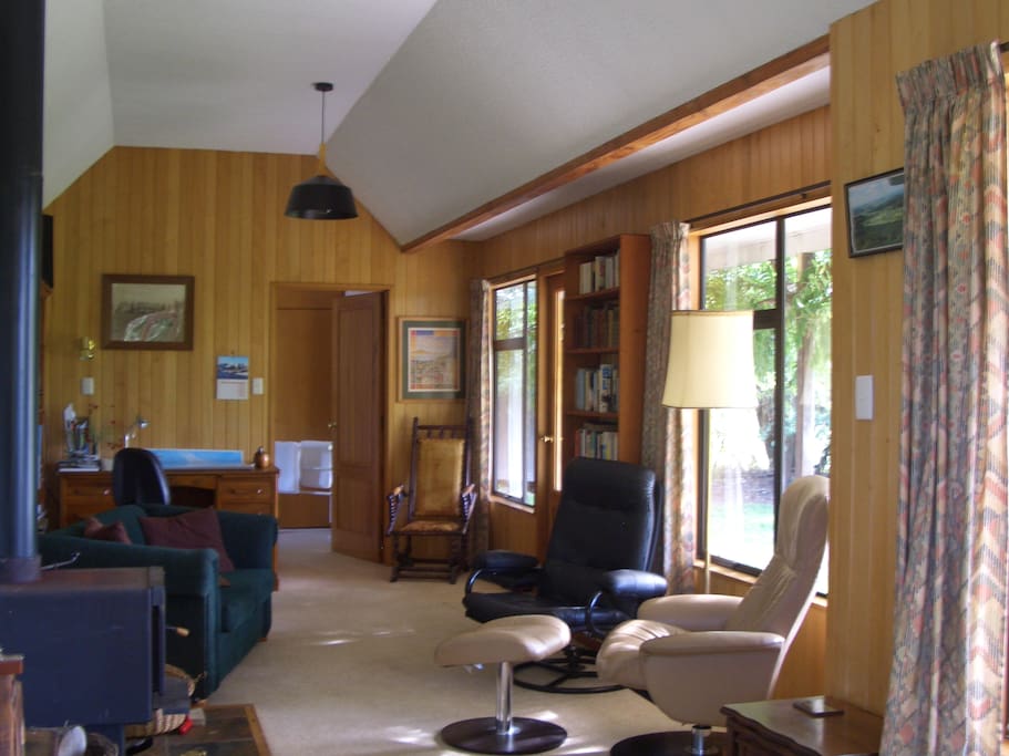 Large sunny living area, with wood burner