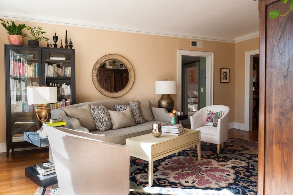 Living room with seating for 6 and lots of books.