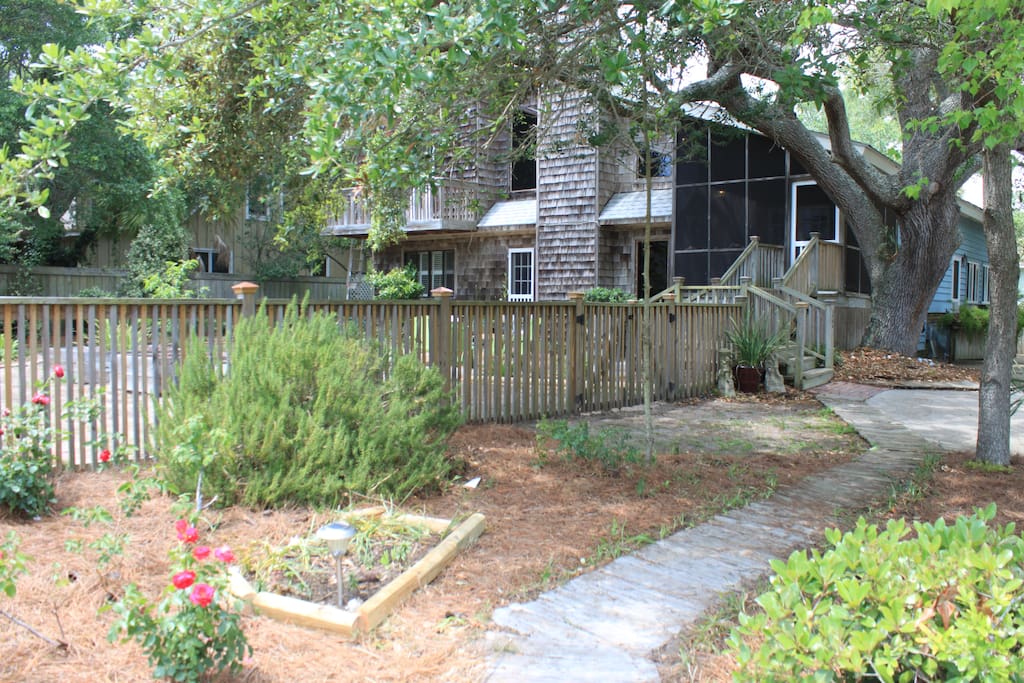 Walk out this door, down the steps and follow the road right to the beach!