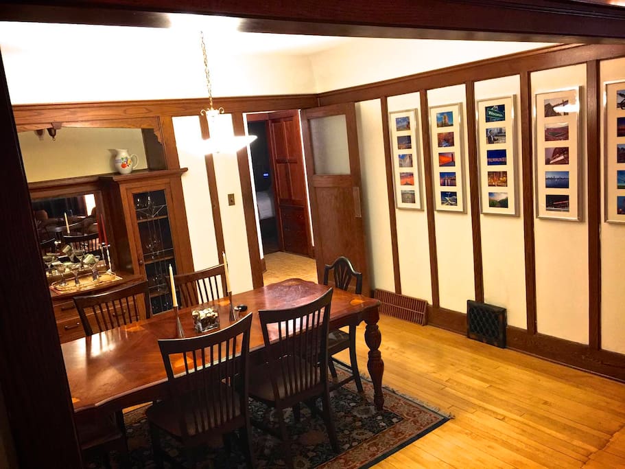 Huge dining room table with built-in art glass china cabinets.