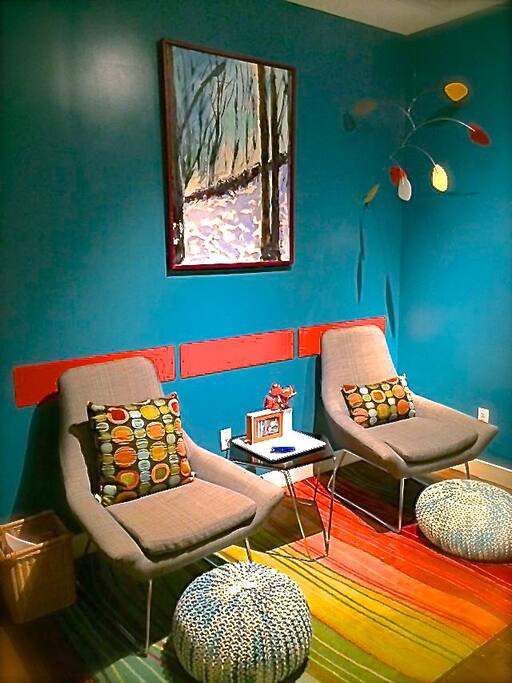 Upstairs reading and relaxing space with floor to ceiling windows overlooking the Hudson River
