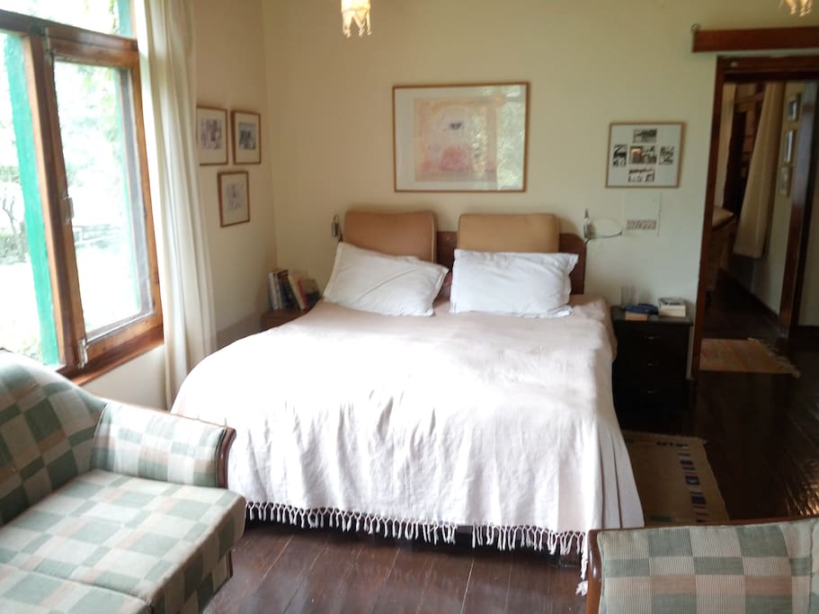 One of the two bedrooms. Apple trees visible from both windows in this room