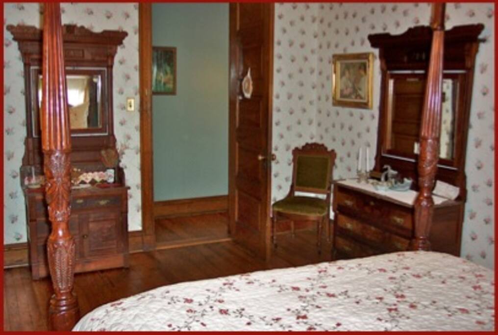 Garden Room with queen sized four post bed and private bath with claw foot bath and shower