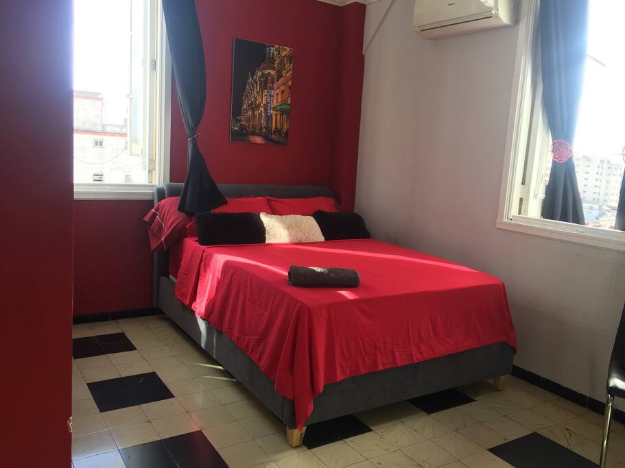 Bedroom with Queen size bed and comfortable mattress, from the windows an spectacular view of the city and the sea.