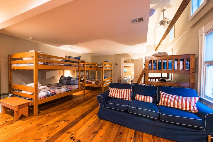 The famous bedroom, popular with both young and older, 4 double beds and 2 twin sized beds for a total of six
