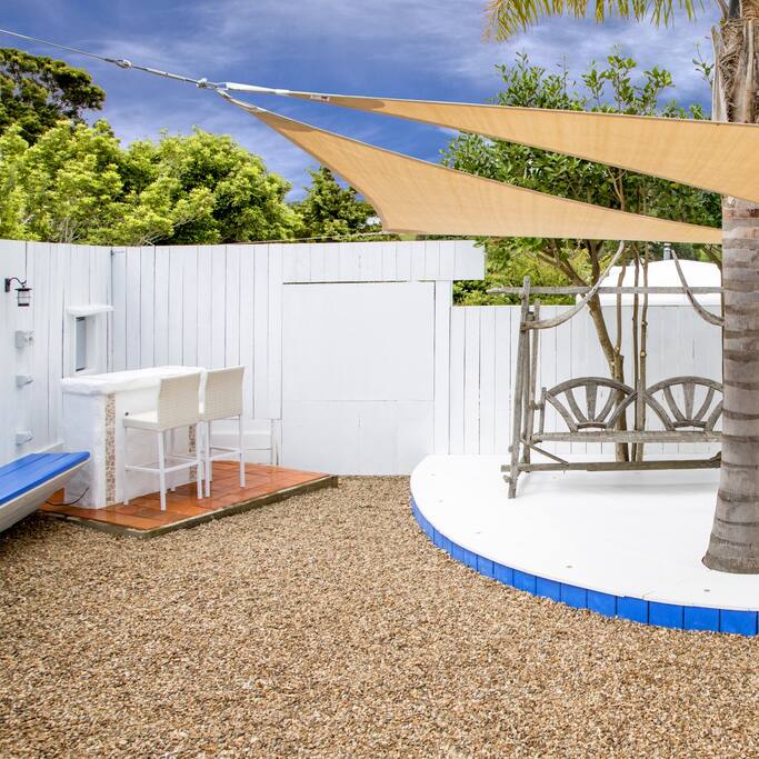Outside Bar, bar fridge, seating in the sun.